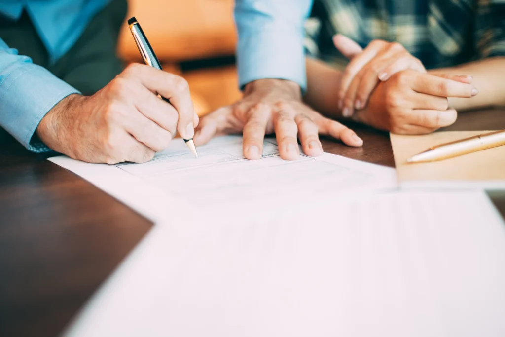 A modern family discussing future plans with a professional offering Will Writing Service Loughborough