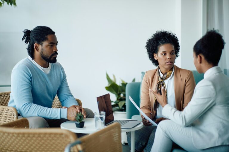 A confidential discussion between a client and a professional about Will Writing Services Loughborough in a private office setting